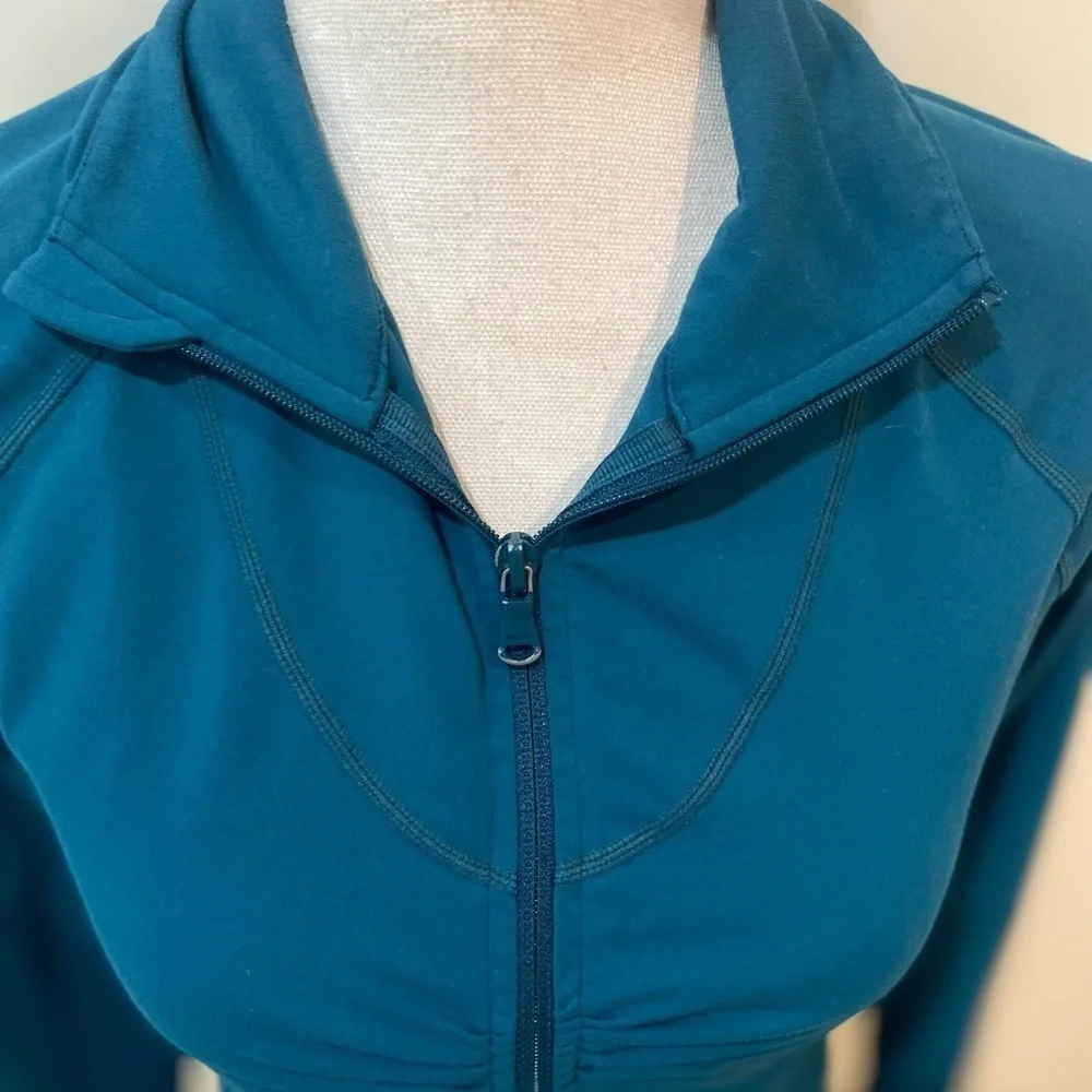 Zella zip up teal ruched athletic jacket with zip up pockets & ruffle back small